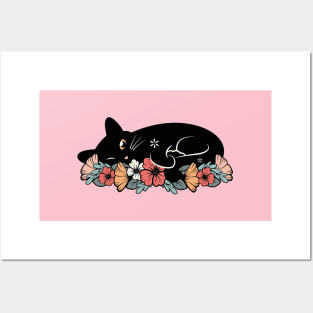 Cute black cat on a bed of flowers Posters and Art